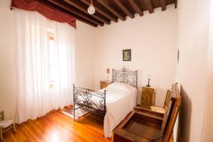 Кровать или кровати в номере Villa Piloni Carfagnoi