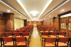 a room with rows of chairs and a table at Le Maritime Kochi in Cochin +14 photos
