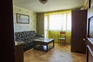 a living room with a couch and a table at Villa Katalina in Varna City