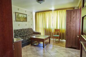 a living room with a couch and a table at Villa Katalina in Varna City