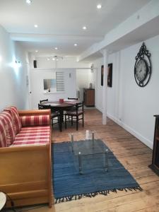 a living room with a couch and a table at La Manufacture in La Tour-du-Pin