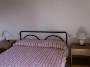 Llit o llits en una habitació de Appartamenti Terranera