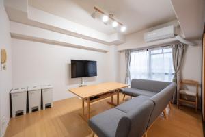TV a/nebo společenská místnost v ubytování Ushamy's KOKURA STAY No 04