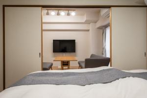 TV a/nebo společenská místnost v ubytování Ushamy's KOKURA STAY No 04