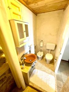 a bathroom with a sink and a toilet at Villa san Gaetano in Scauri
