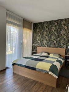Rúm í herbergi á Apartman PLAY Divčibare - 2 spavaće sobe