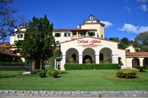 a building with a sign on the front of it at Hotel Glória Resort & Convention in Caxambu