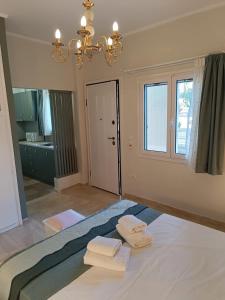 Ένα ή περισσότερα κρεβάτια σε δωμάτιο στο Athens Royal Suite