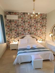 Ένα ή περισσότερα κρεβάτια σε δωμάτιο στο Athens Royal Suite