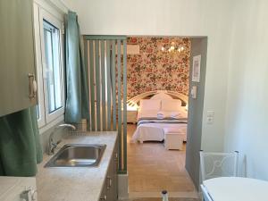 Ένα ή περισσότερα κρεβάτια σε δωμάτιο στο Athens Royal Suite