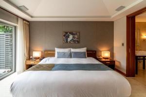 Postel nebo postele na pokoji v ubytování The Seaes Hotel & Resort + 38 fotografií