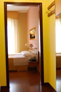 Postel nebo postele na pokoji v ubytování Hotel Ristorante Donato
