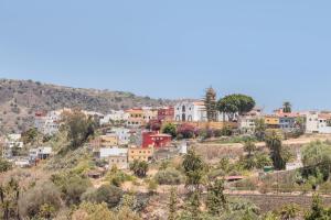 a town on a hill with houses and trees at Casa Isabel in Santa Brígida