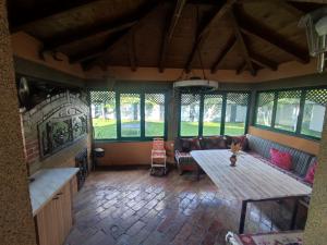 a living room with a table and a couch at Villa Hills in Sarajevo