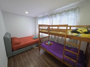 Postel nebo postele na pokoji v ubytování Deefah Homestay Taman Sepanggar Kota Kinabalu