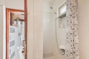 a bathroom with a shower with a glass door at Casa Isabel in Santa Brígida +23 photos