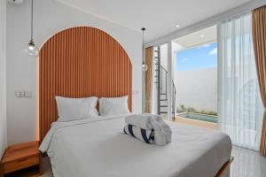 Giường trong phòng chung tại Oasis Villa Seminyak