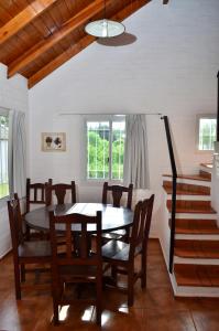 a dining room with a table and chairs at Complejo Las Hoyas in Villa Carlos Paz