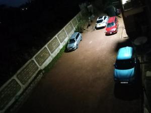 a group of cars parked in a parking lot at BIGO Apartment in Marsabit +1 photo