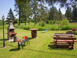 a park with a picnic table and a fire pit at Modern Holiday Home in Pietrafitta Umbria with Garden in Pietrafitta