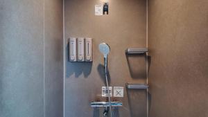 a bathroom with a urinal on a wall at SunVILLA EASTEND in Choshi +26 photos