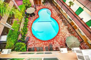 a large pool in the middle of a building at Dunes Inn - Wilshire in Los Angeles