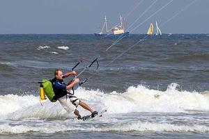 a man is water skiing in the ocean at Amsterdam Beach Apartment in Zandvoort