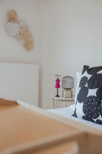 Postel nebo postele na pokoji v ubytování Garnet Studio Flats
