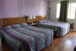 Postel nebo postele na pokoji v ubytování Motel 101