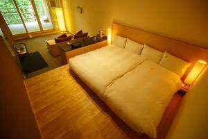 Postel nebo postele na pokoji v ubytování Kinnotake Tonosawa (Adult Only)