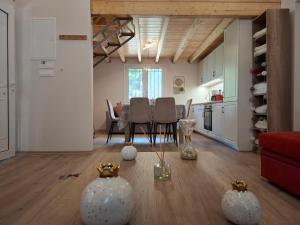 a kitchen and dining room with a table and chairs at Dryades in Elati Zagori