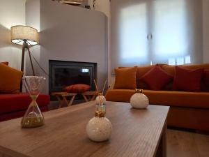 a living room with a couch and a coffee table at Dryades in Elati Zagori