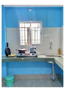 Kuchyň nebo kuchyňský kout v ubytování APON GHAR homestay