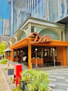 a dunkin donuts building with a sign on it at Agile Premier Suites KL in Kuala Lumpur