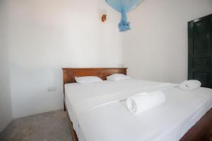 เตียงในห้องที่ Why Not Hostel