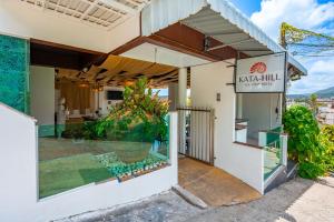 a building with a sign that reads natal hill at Hotel Kata Hill Sea View in Kata Beach