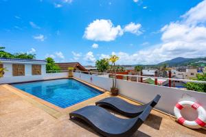 a swimming pool on the roof of a house at Hotel Kata Hill Sea View in Kata Beach