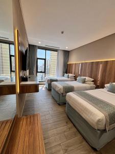 En eller flere senger på et rom på فندق نسمات مكةNasamat Makkah Hotel