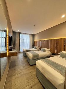 En eller flere senger på et rom på فندق نسمات مكةNasamat Makkah Hotel