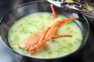 a bowl of soup with a shrimp on top at 下田温泉 湯本の荘 夢ほたる in Amakusa