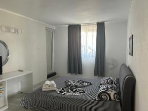 Giường trong phòng chung tại Casa Athena