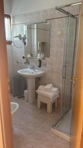 a bathroom with a sink and a shower at Agriturismo Costadoro in Bardolino +60 photos