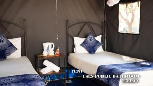 Ένα ή περισσότερα κρεβάτια σε δωμάτιο στο Rest Camp Victoria Falls