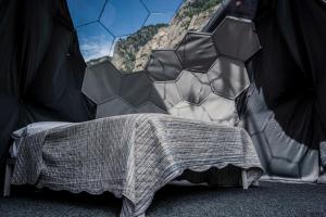 a bedroom with a bed with a soccer ball mural at Bubble Room Gran Paradiso in Noasca