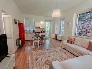 a living room with a couch and a table at Villa Miami Taormina in Taormina