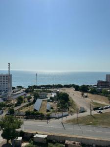 a view of a parking lot next to the ocean at Студия с Видом на Море, 9-2 in Chornomorsk