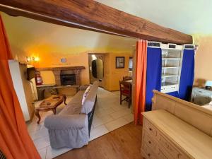 a living room with two couches and a kitchen at Luigi's Apartment in Biella
