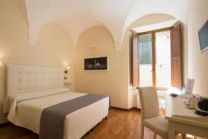 Postel nebo postele na pokoji v ubytování B&B Quattro Cantoni