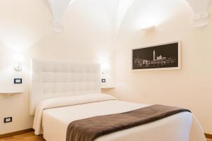 Postel nebo postele na pokoji v ubytování B&B Quattro Cantoni