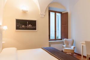 Postel nebo postele na pokoji v ubytování B&B Quattro Cantoni